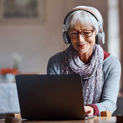 Mature woman taking an online hearing tst 